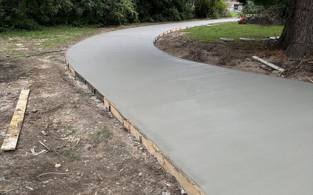 Completed concrete driveway by OAX Construction